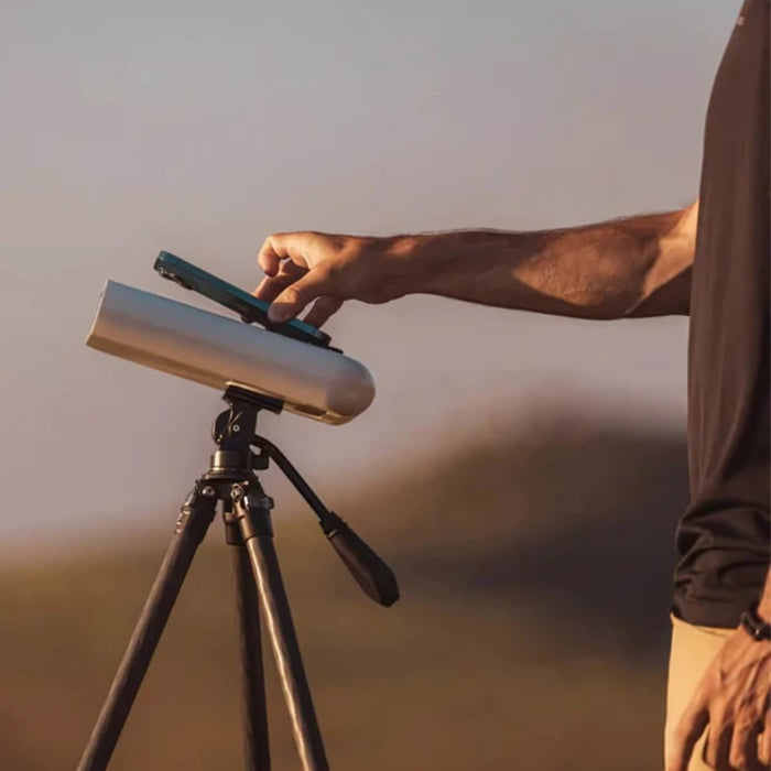 Vaonis Hestia Telescope Solar Pack and a Man Holding a Smartphone
