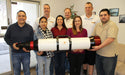 Group of Staff Holding Lunt 230mm Double Stack Solar Telescope with 34mm Blocking Filter
